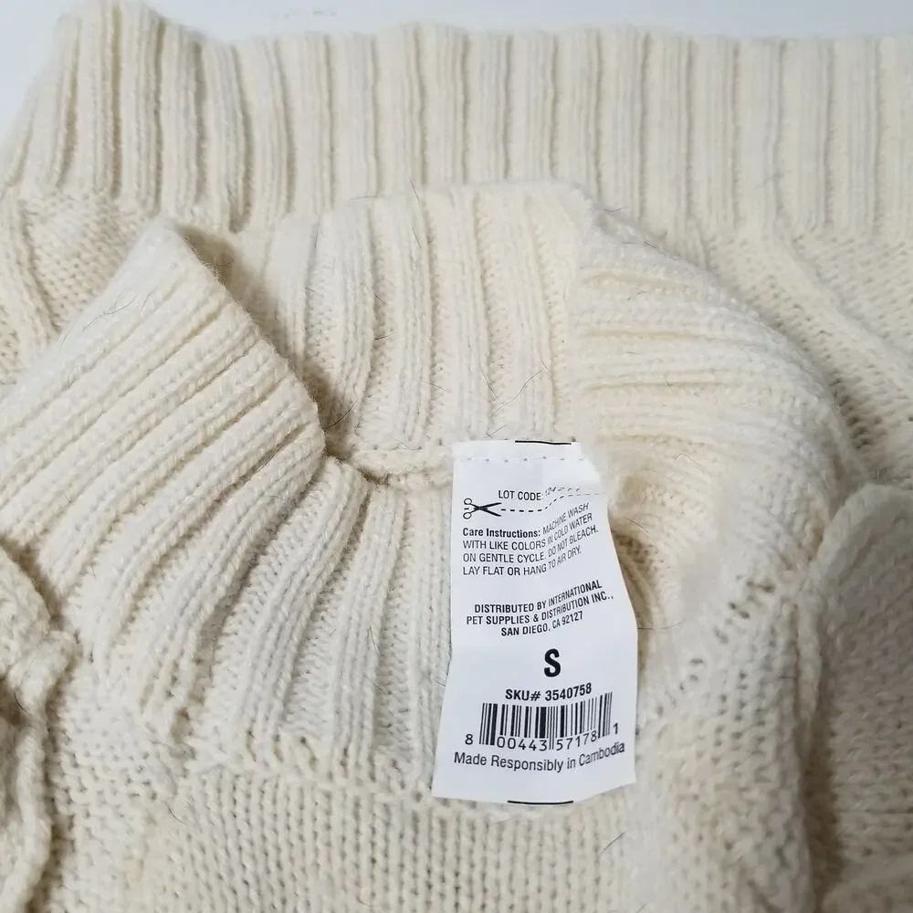 small girl doggie light sweater  one small faint stain on underside of sweater